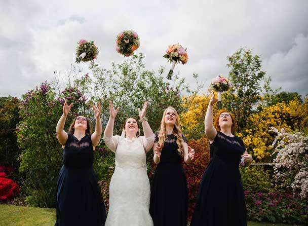 Bride throwing her bouquet at Cragwood Country House