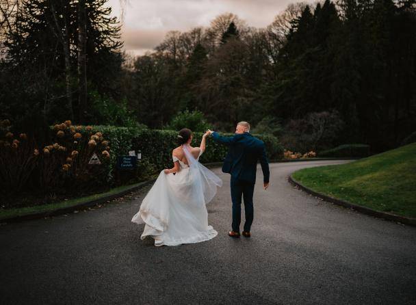 bride and groom on drive