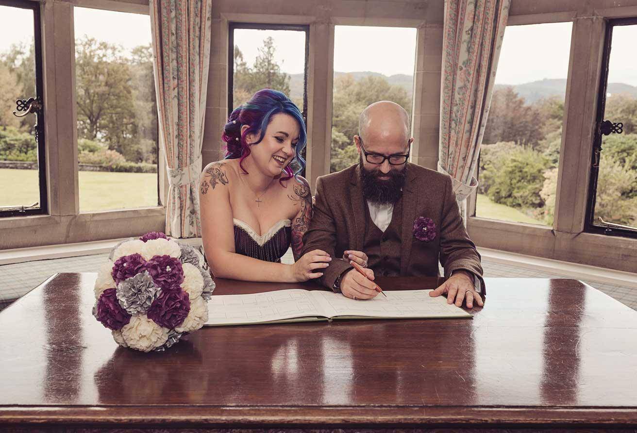 Signing the Wedding register at Cragwood