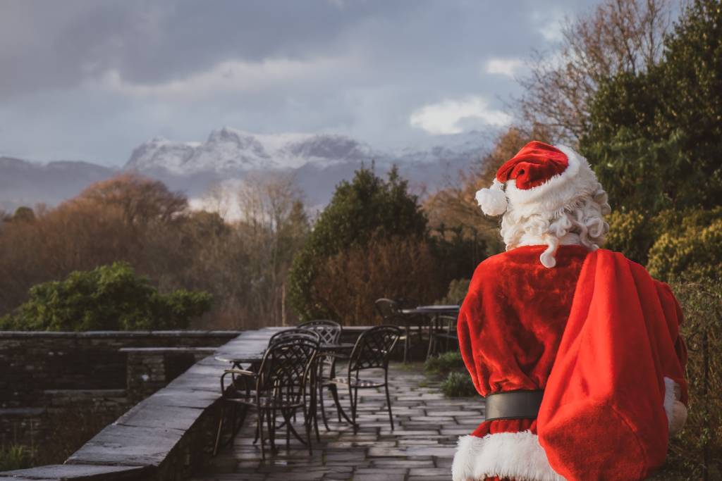 Santa looking at Lake Windermere and surrounding fells from Cragwood's lake view terrace